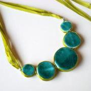 Statement necklace in shades of turquoise, jade and green